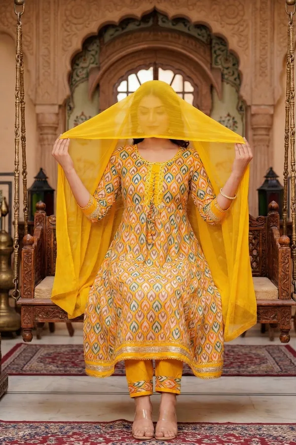 Womens_Mustard_Yellow_Printed_Rayon_Kurti_Pant_Dupatta_Set_With_Round_Neck_Lace_Detail_And_Tie-Up_Design