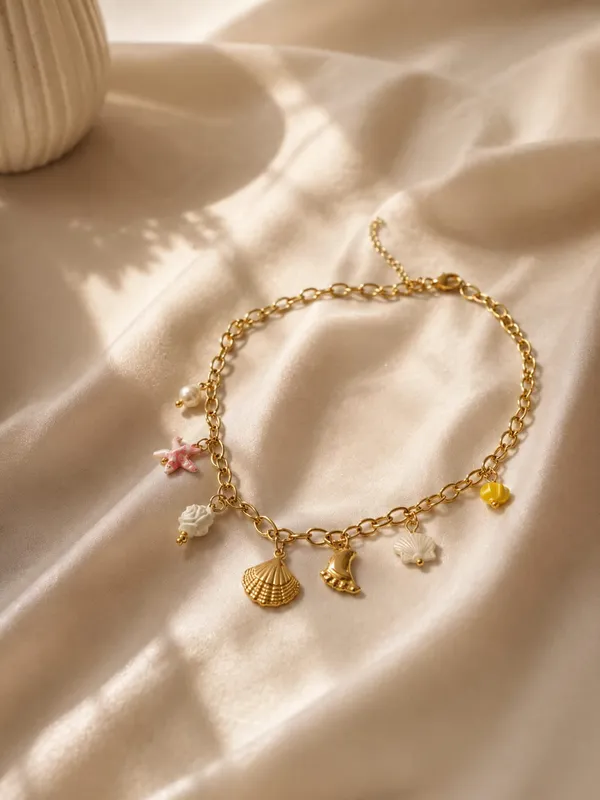 Gold_Toned_Charm_Necklace_With_Seashell_&_Pearl_Pendants