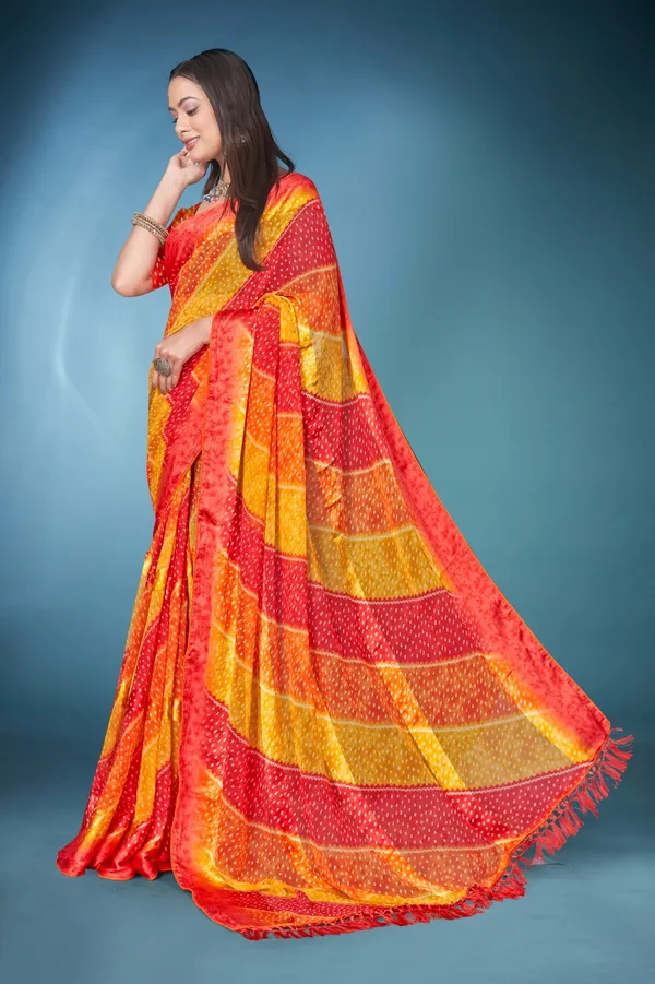 Vibrant_Bandhani_Silk_Saree_In_Red,_Orange,_And_Yellow_With_Matching_Blouse