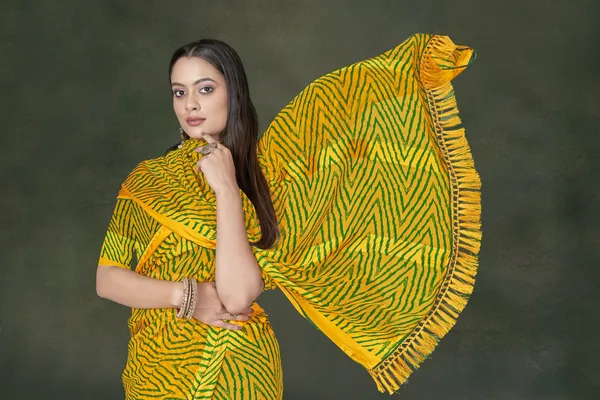 Yellow_And_Green_Bandhani_Print_Georgette_Saree_With_Ruffled_Border
