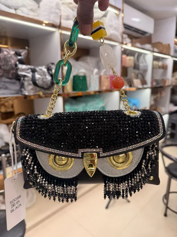 Black_Mini_Handbag_With_Logo_Clasp
