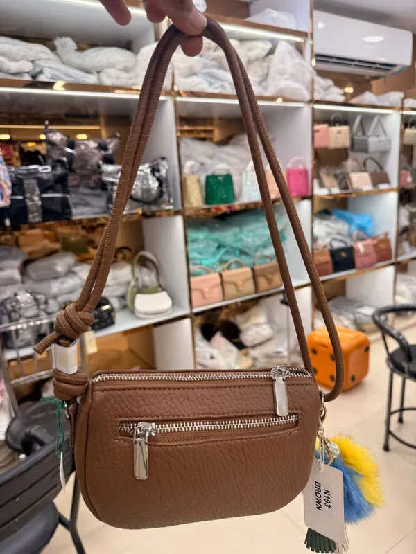 Brown_Crossbody_Bag_With_Pom-Pom_Charm