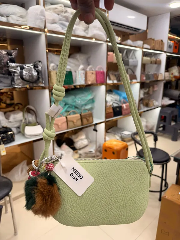 Green_Textured_Crossbody_Bag_With_Fur_Charm