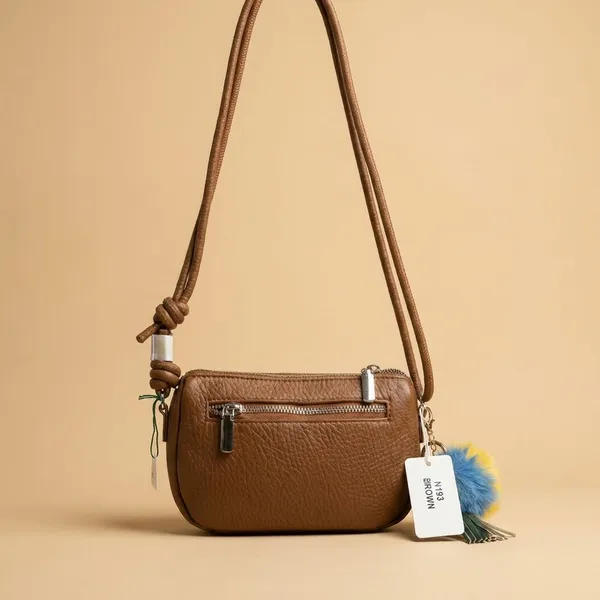 Brown_Crossbody_Bag_With_Pom-Pom_Charm