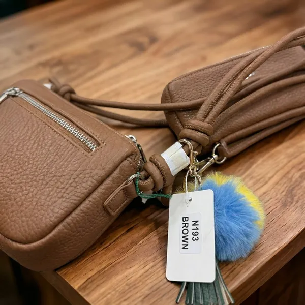 Brown_Crossbody_Bag_With_Pom-Pom_Charm