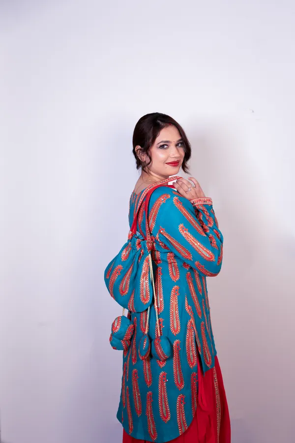 Turquoise_Blue_&_Red_Women_Embroidered_Ethnic_Kurti_With_Red_Sharara_Set