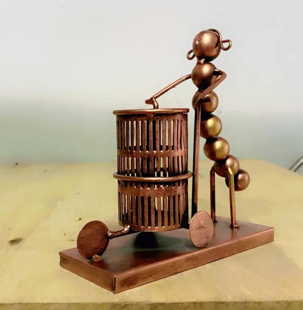 Decorative_Metal_Figure_With_Cylindrical_Cage_-_Artistic_Tabletop_Sculpture