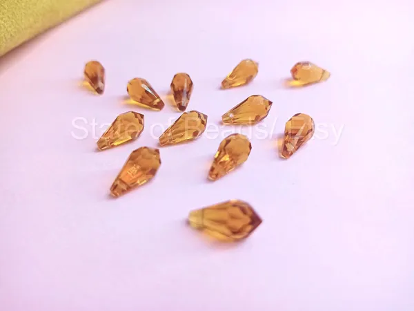 Genuine_Swarovski_Golden_Teardrop_Charm_Beads_|_5.5mm_|_4_Pcs