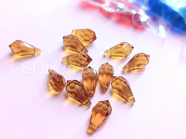Genuine_Swarovski_Golden_Teardrop_Charm_Beads_|_5.5mm_|_4_Pcs