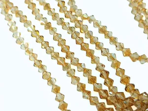 Genuine_Swarovski_Golden_Bicone_Crystal_Beads_|_4mm_|_36_Pcs