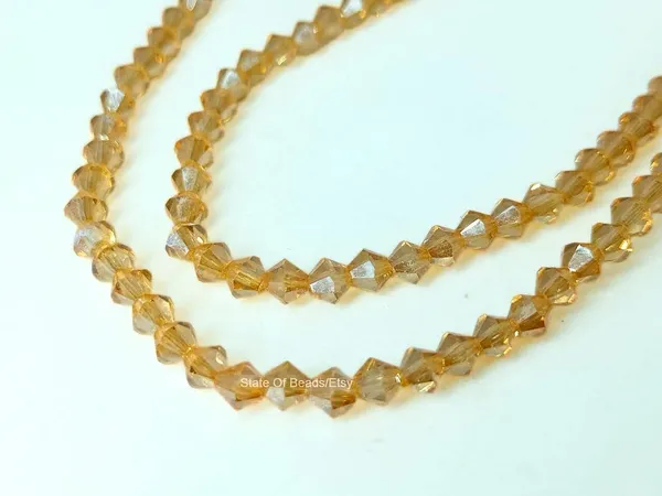 Genuine_Swarovski_Golden_Bicone_Crystal_Beads_|_4mm_|_36_Pcs