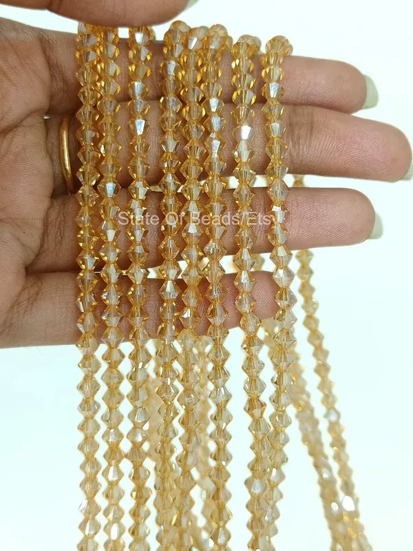 Genuine_Swarovski_Golden_Bicone_Crystal_Beads_|_4mm_|_36_Pcs
