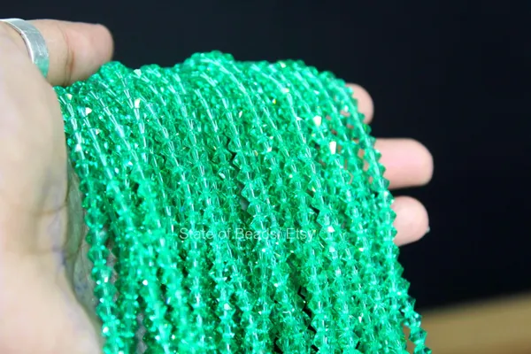 Genuine_Swarovski_Green_Bicone_Crystal_Beads_|_4mm_|_1_Pcs