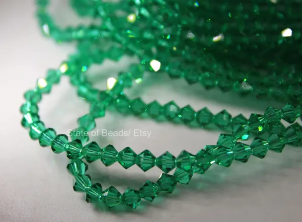 Genuine_Swarovski_Green_Bicone_Crystal_Beads_|_4mm_|_1_Pcs