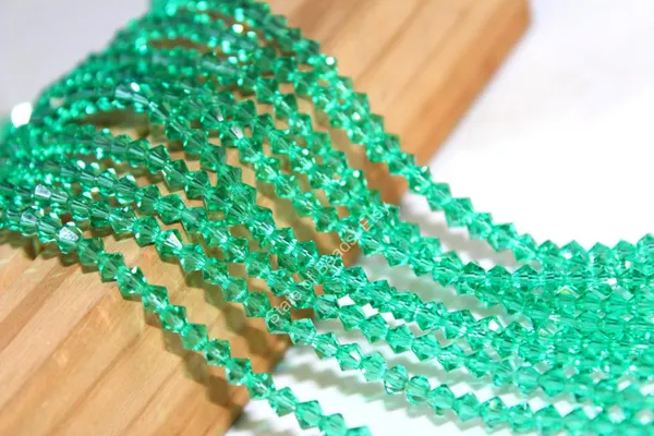 Genuine_Swarovski_Green_Bicone_Crystal_Beads_|_4mm_|_1_Pcs
