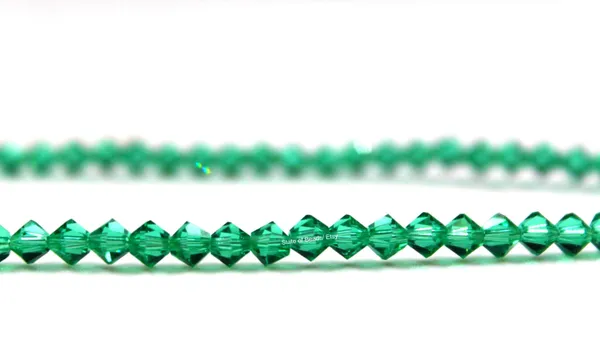 Genuine_Swarovski_Green_Bicone_Crystal_Beads_|_4mm_|_1_Pcs