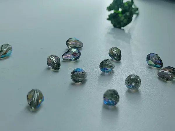 Genuine_Swarovski_Grey_Teardrop_Charm_Beads_|_6.5mm_|_4_Pcs