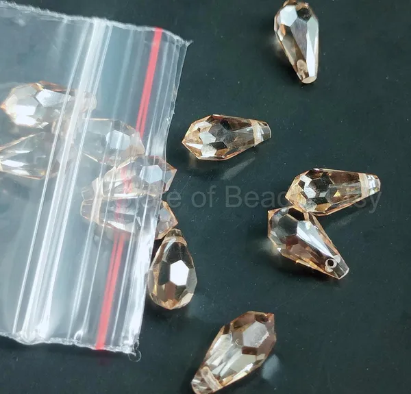 Genuine_Swarovski_Brown_Teardrop_Charm_Beads_|_6.5mm_|_4_Pcs