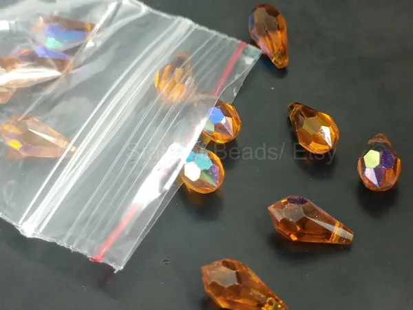 Genuine_Swarovski_Orange_Teardrop_Charm_Beads_|_6.5mm_|_4_Pcs