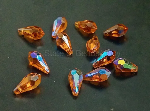 Genuine_Swarovski_Orange_Teardrop_Charm_Beads_|_6.5mm_|_4_Pcs