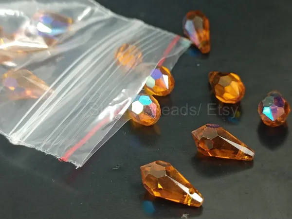Genuine_Swarovski_Orange_Teardrop_Charm_Beads_|_6.5mm_|_4_Pcs