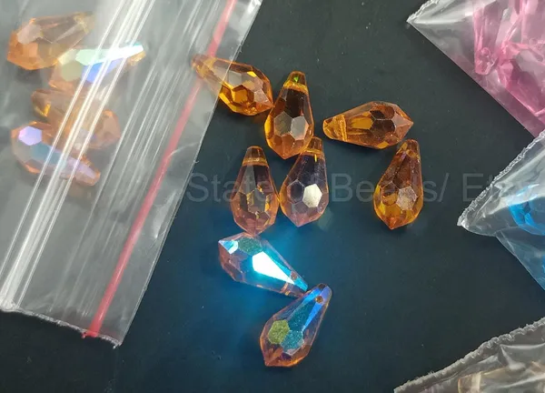Genuine_Swarovski_Orange_Teardrop_Charm_Beads_|_6.5mm_|_4_Pcs