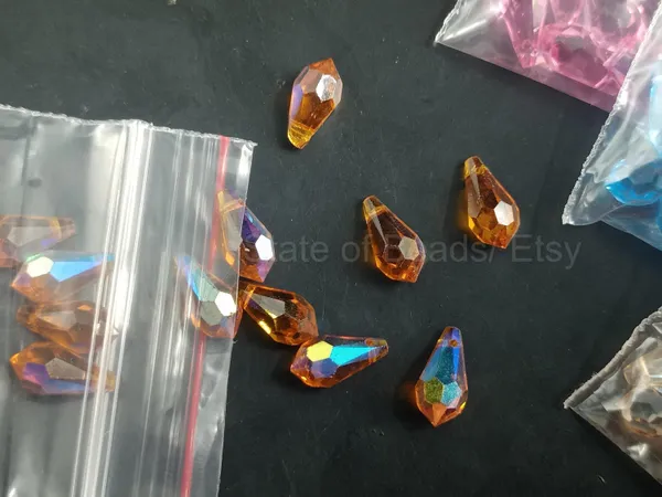 Genuine_Swarovski_Orange_Teardrop_Charm_Beads_|_6.5mm_|_4_Pcs