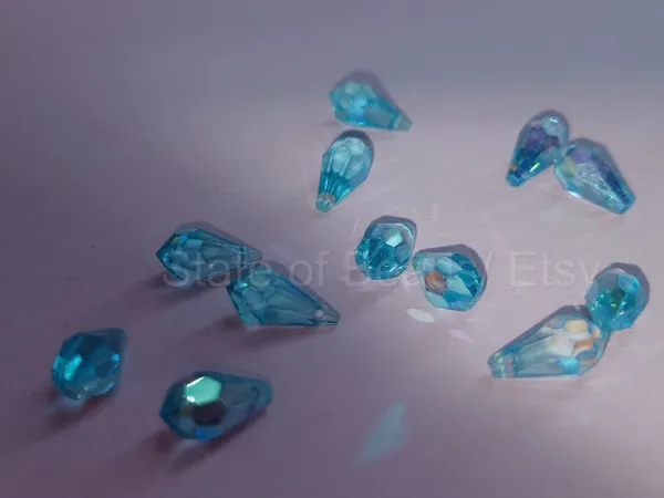Genuine_Swarovski_Sky_Blue_Teardrop_Charm_Beads_|_5.5mm_|_4_Pcs
