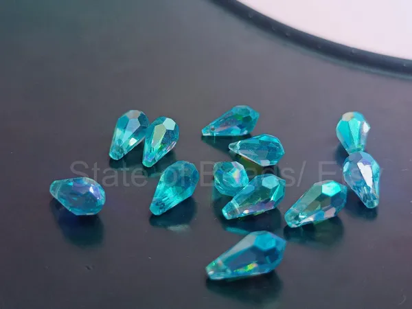 Genuine_Swarovski_Sky_Blue_Teardrop_Charm_Beads_|_5.5mm_|_4_Pcs
