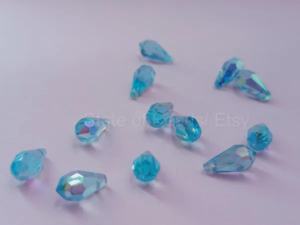 Genuine_Swarovski_Sky_Blue_Teardrop_Charm_Beads_|_5.5mm_|_4_Pcs