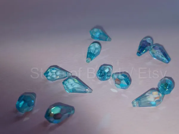 Genuine_Swarovski_Sky_Blue_Teardrop_Charm_Beads_|_5.5mm_|_4_Pcs