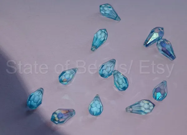 Genuine_Swarovski_Sky_Blue_Teardrop_Charm_Beads_|_5.5mm_|_4_Pcs