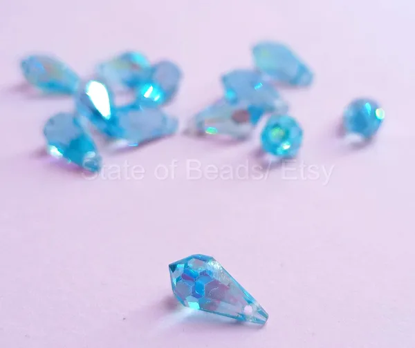 Genuine_Swarovski_Sky_Blue_Teardrop_Charm_Beads_|_5.5mm_|_4_Pcs