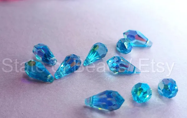 Genuine_Swarovski_Sky_Blue_Teardrop_Charm_Beads_|_5.5mm_|_4_Pcs