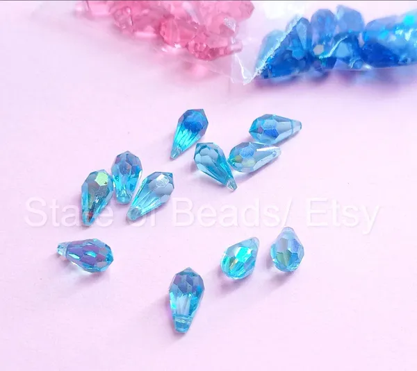Genuine_Swarovski_Sky_Blue_Teardrop_Charm_Beads_|_5.5mm_|_4_Pcs