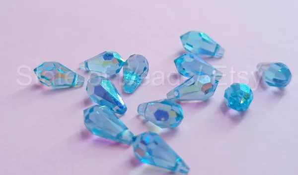 Genuine_Swarovski_Sky_Blue_Teardrop_Charm_Beads_|_5.5mm_|_4_Pcs