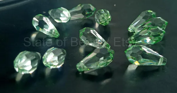 Genuine_Swarovski_Green_Teardrop_Charm_Beads_|_7.5mm_|_4_Pcs