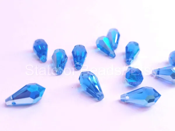 Genuine_Swarovski_Blue_Teardrop_Charm_Beads_|_4_Pcs