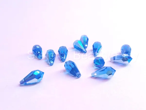 Genuine_Swarovski_Blue_Teardrop_Charm_Beads_|_4_Pcs