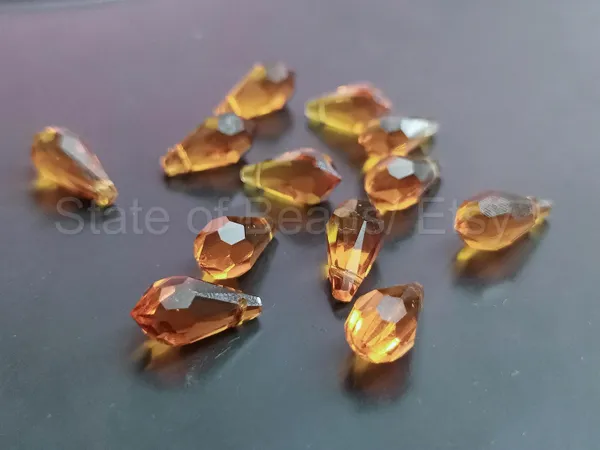 Genuine_Swarovski_Brown_Teardrop_Charm_Beads_|_5.5mm_|_4_Pcs