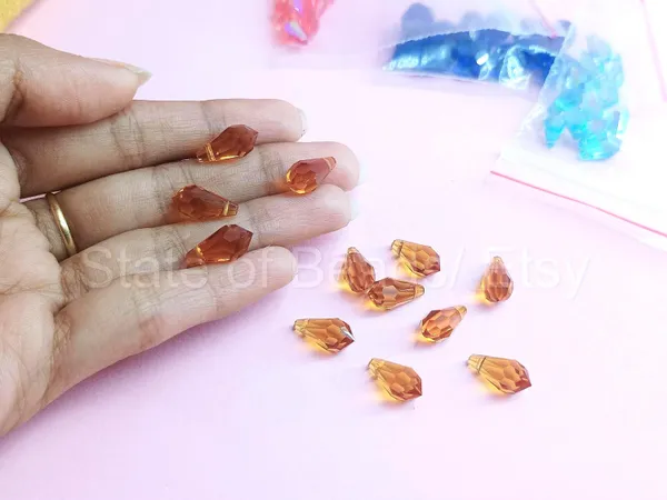 Genuine_Swarovski_Brown_Teardrop_Charm_Beads_|_5.5mm_|_4_Pcs