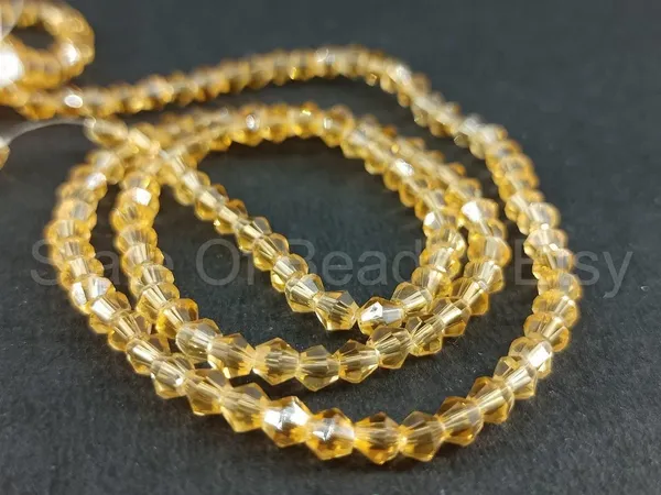 Multi_Colour_Bicone_Glass_Beads_|_3mm_|_10_strands_x_120_beads_each_(Total_1200_beads)