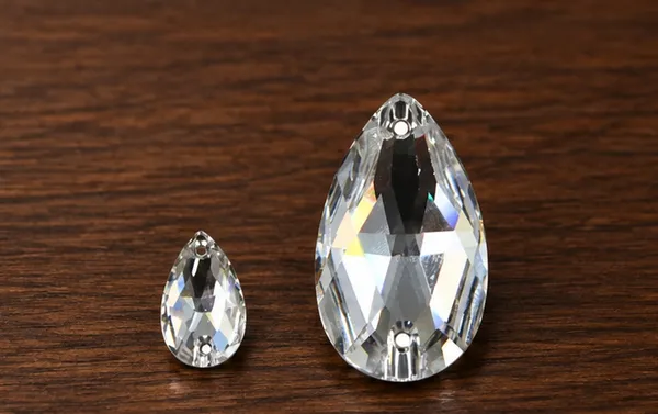Genuine_Swarovski_White_Teardrop_Charm_Beads_|_4_Pcs_|_Size_12x7mm_and_18x10.5mm
