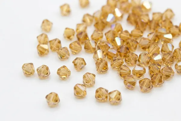 Genuine_Swarovski_Golden_Shadow_Bicone_Crystal_Beads_|_4mm_|_36_Pcs
