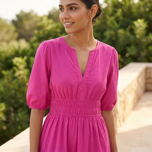 Elegant_Fuchsia_Pink_Tiered_Midi_Dress_With_Smocked_Waist_And_Puff_Sleeves