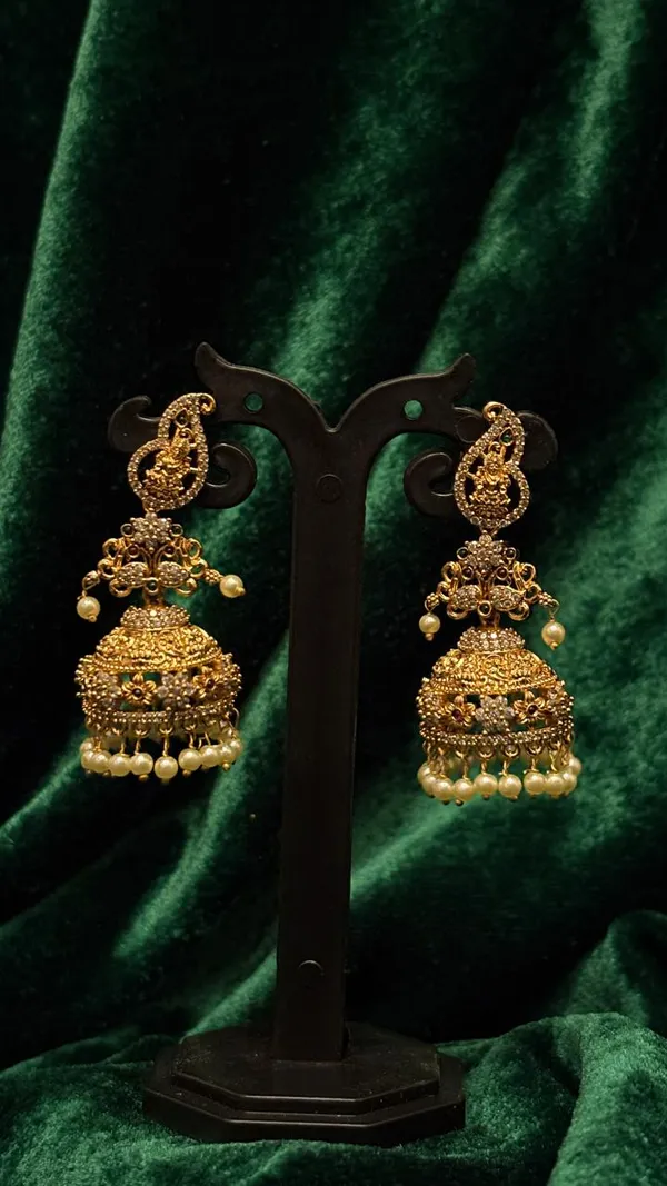 Traditional_Golden_Jhumka_Earrings_with_Pearl_Drops_and_Peacock_Design