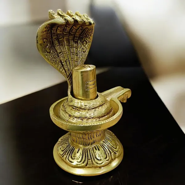 Sjl_Brass_Shivling_Religious_Idol_The_Symbol_For_The_Creation_Of_The_Universe_Decorative_Showpiece_16_Cm_Brass_Gold