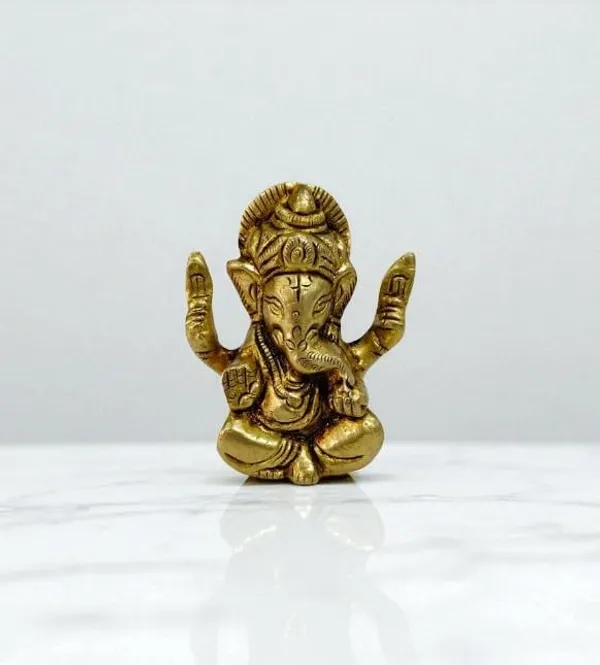 Sjl_Exports_Brass_Lord_Ganesha_Idol_Sitting_Position_With_4_Hands_For_Puja_Handcrafted_Brass_Ganesha_Statue_Sitting_Ganpati_Murti_With_Four_Arms_5_Cm