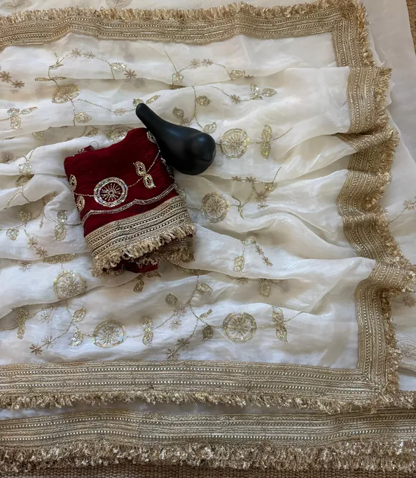 White_Embroidered_Saree_With_Gold_Border_And_Contrast_Maroon_Blouse