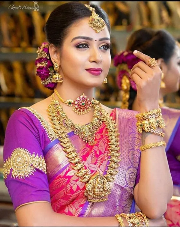 Pink_And_Purple_Kanjivaram_Silk_Bridal_Saree_With_Heavy_Gold_Zari_Work